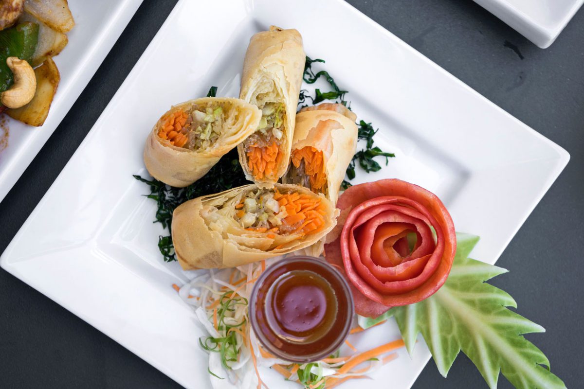 Crispy spring rolls with dipping sauce.